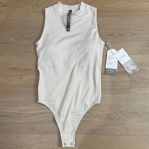 Vuori Halo Mock Bodysuit in Cream